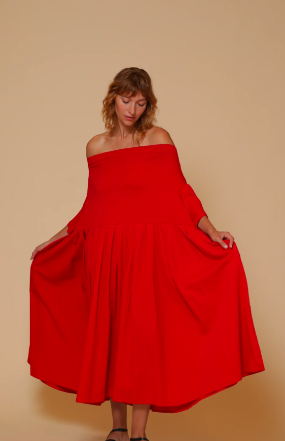  off-the-shoulder red maxi dress with a voluminous, gathered skirt.